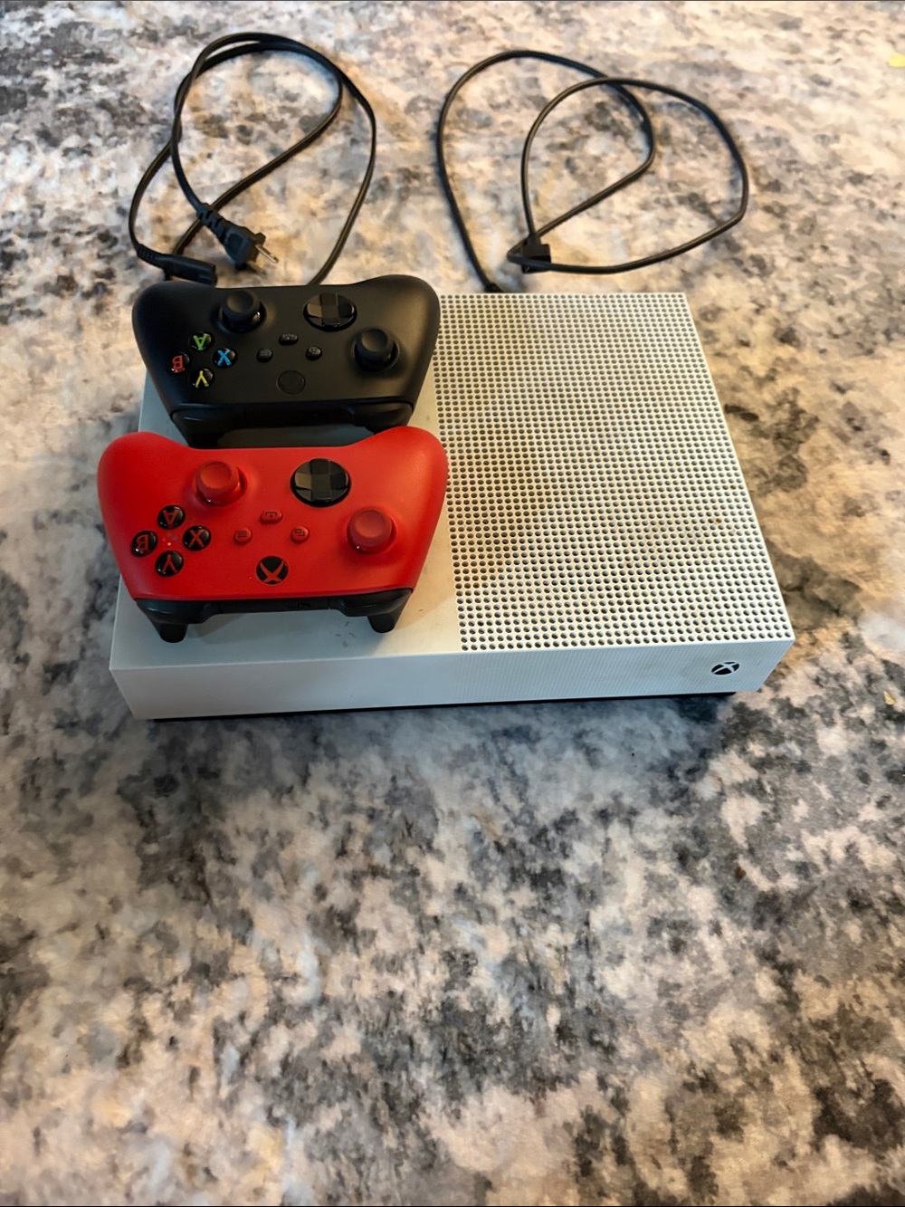 One S Console with Black and Red Wireless Controllers